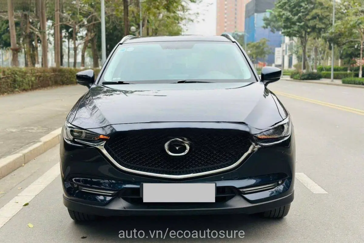 Hình ảnh Mazda CX-5 2019 màu đỏ đang di chuyển trên đường, thể hiện độ bền thiết kế sau 7 năm.