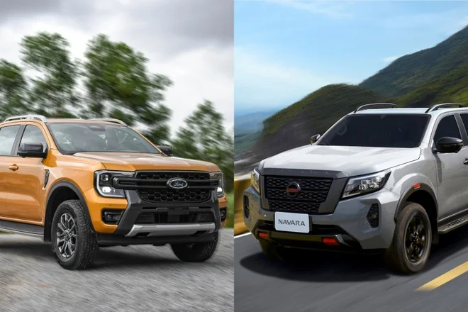 Hai xe bán tải Nissan Navara và Ford Ranger đang di chuyển trên đường ở Việt Nam.